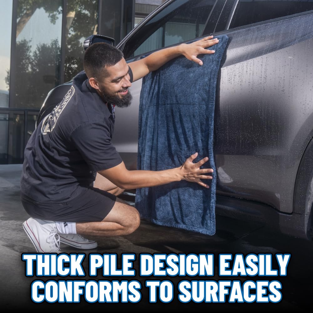 Chemical Guys towel in use drying car hood quickly while protecting paint from scratches