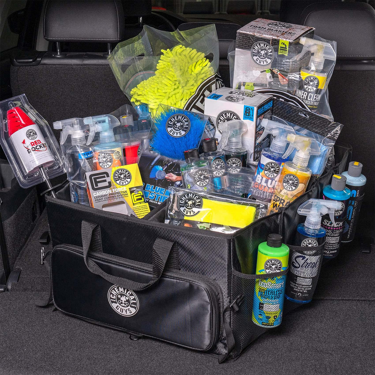 Chemical Guys organizer placed in car trunk to prevent shifting while driving