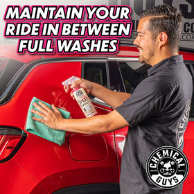 Chemical Guys in-use hand wiping car for quick touch-up benefit