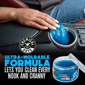 Chemical Guys jar placed in cup holder for quick in-car cleanup convenience