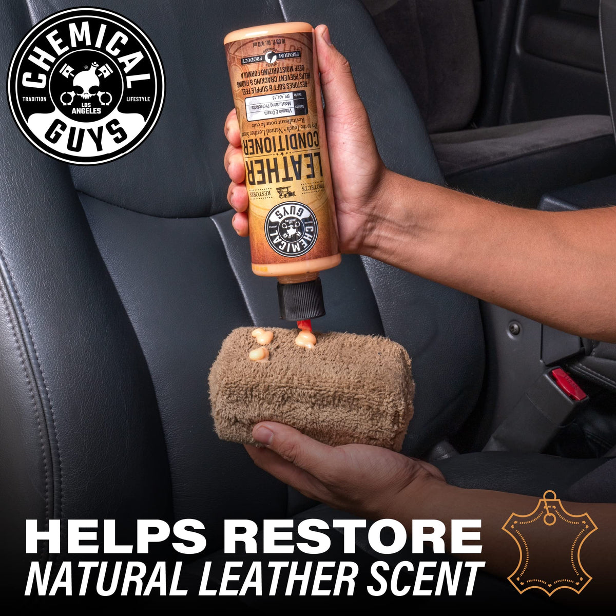 Chemical Guys applicator spreading conditioner on leather seat for softening