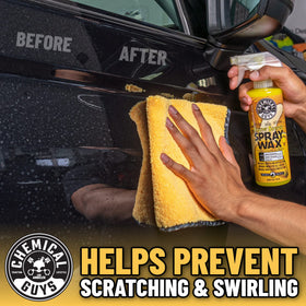 Chemical Guys towel cleaning dashboard and screen showing lint-free interior safety