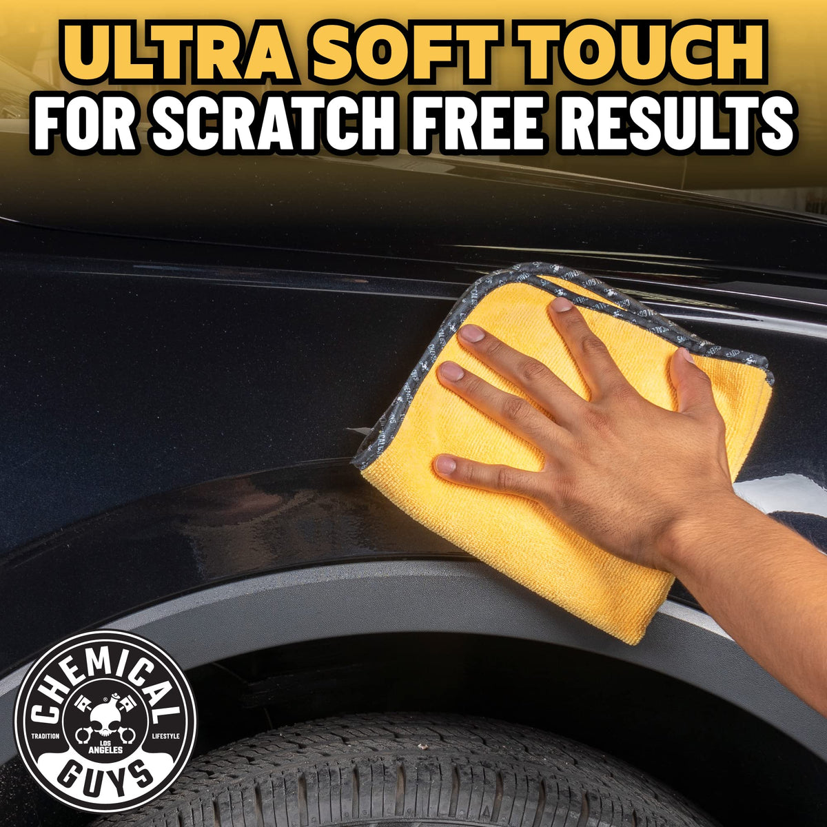 Chemical Guys towel wiping car door paint illustrating swirl-free finish protection