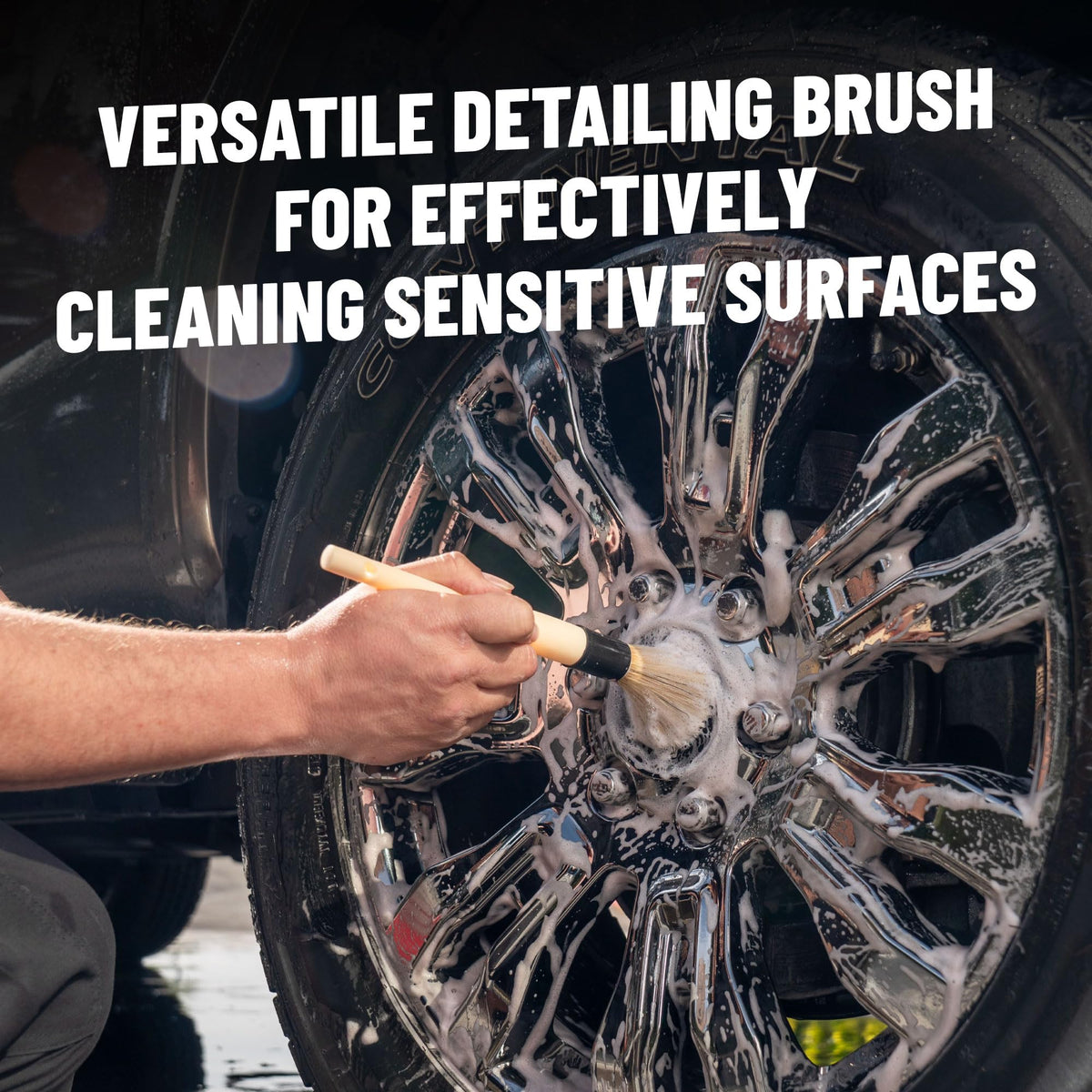 Chemical Guys brush removing grime from wheel spoke, safe delicate cleaning