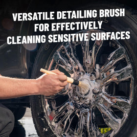 Chemical Guys brush removing grime from wheel spoke, safe delicate cleaning