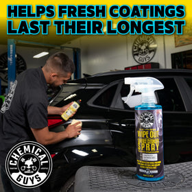 Chemical Guys being wiped with microfiber to reveal paint clarity and inspection
