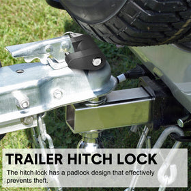 Chumia lock beside coin for scale showing compact portable size
