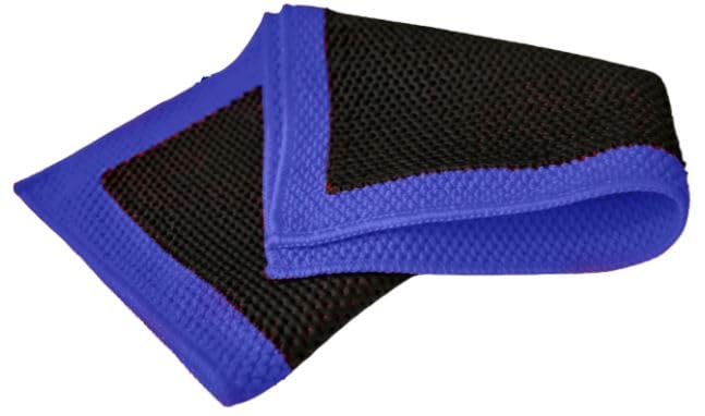 CLEAN. clay towel close-up of perforated surface and microfiber backing, safer decontamination benefit