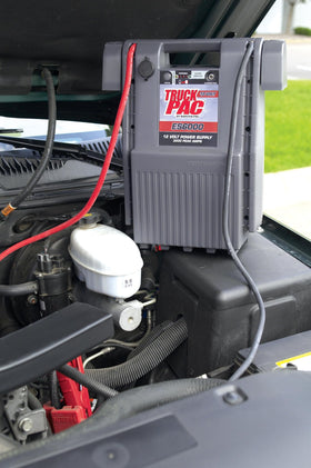 Clore Automotive ES6000 being used to jump start a truck, delivering powerful starting assistance