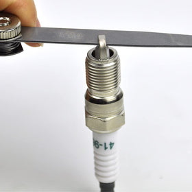 CNPAPC plug beside ruler showing size and reach for proper engine fitment benefit