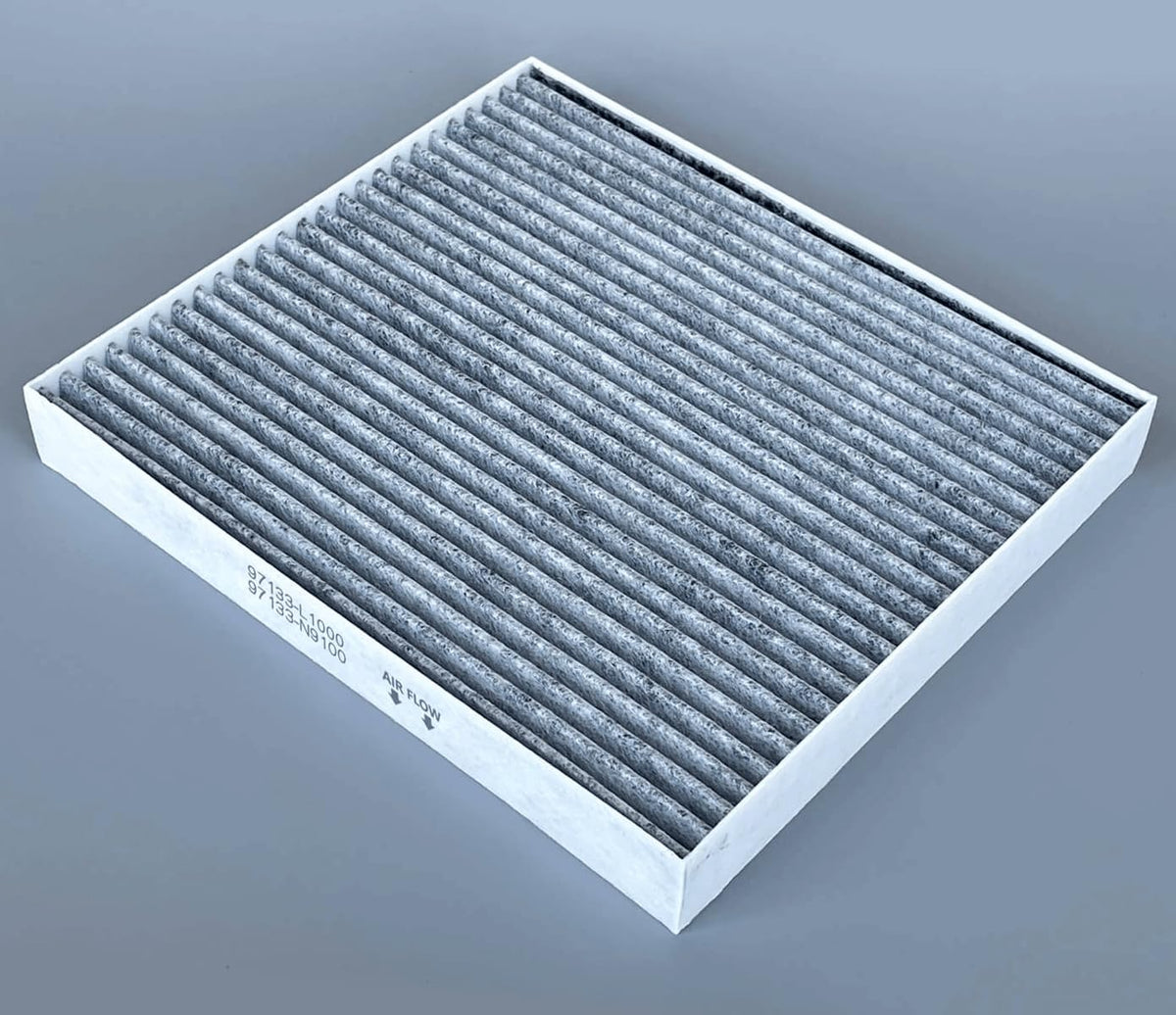 COCOAUTO cabin filter being placed behind glovebox to restore HVAC airflow
