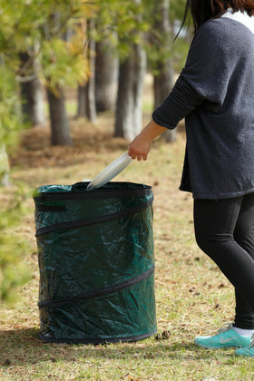 Coghlan's trash can in campsite use demonstrates easy setup and convenient waste containment