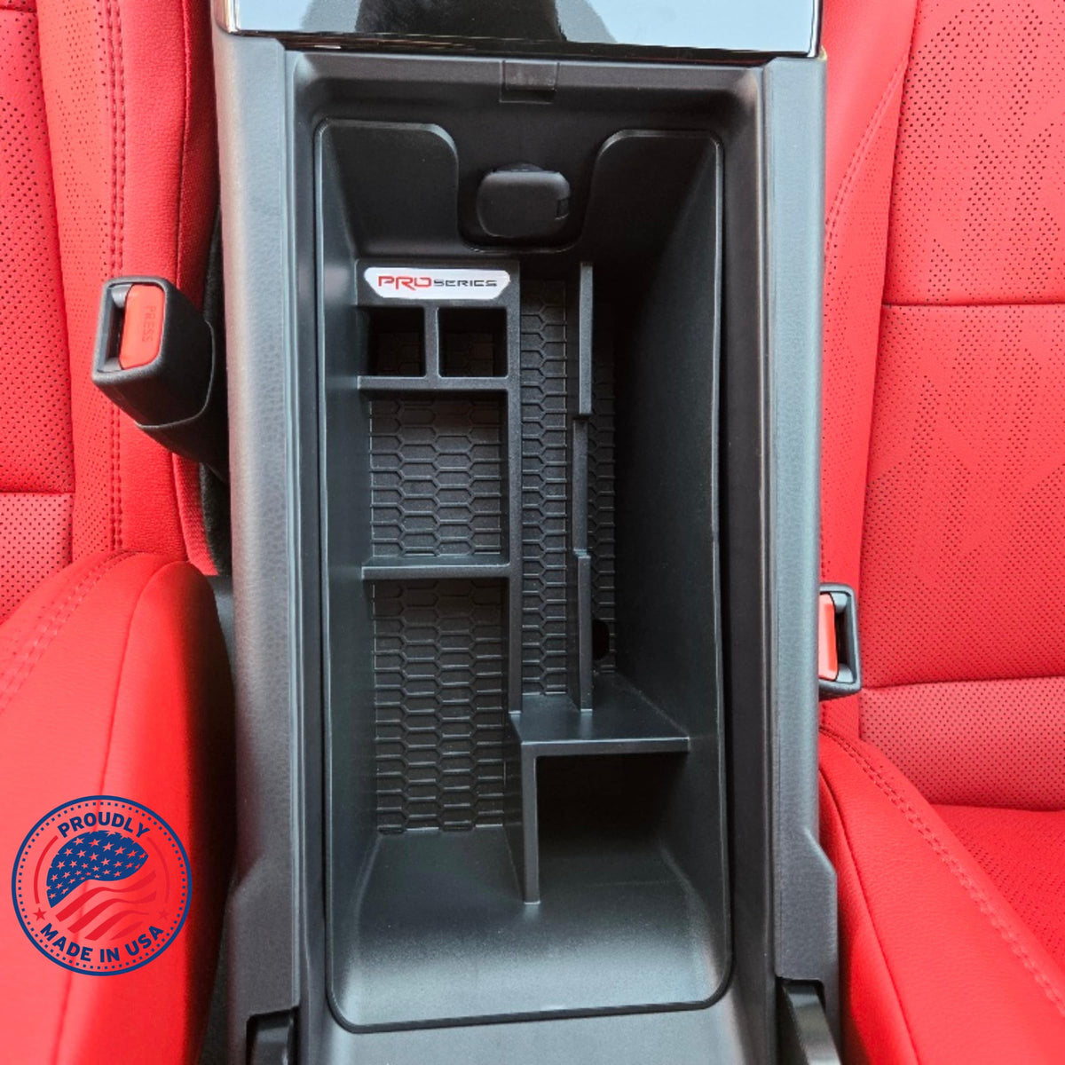 Complete Appearance lifestyle shot inside Camry showing tidy armrest and improved accessibility