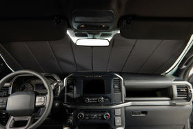 Covercraft UVS100 next to dashboard for scale showing tailored fit benefit