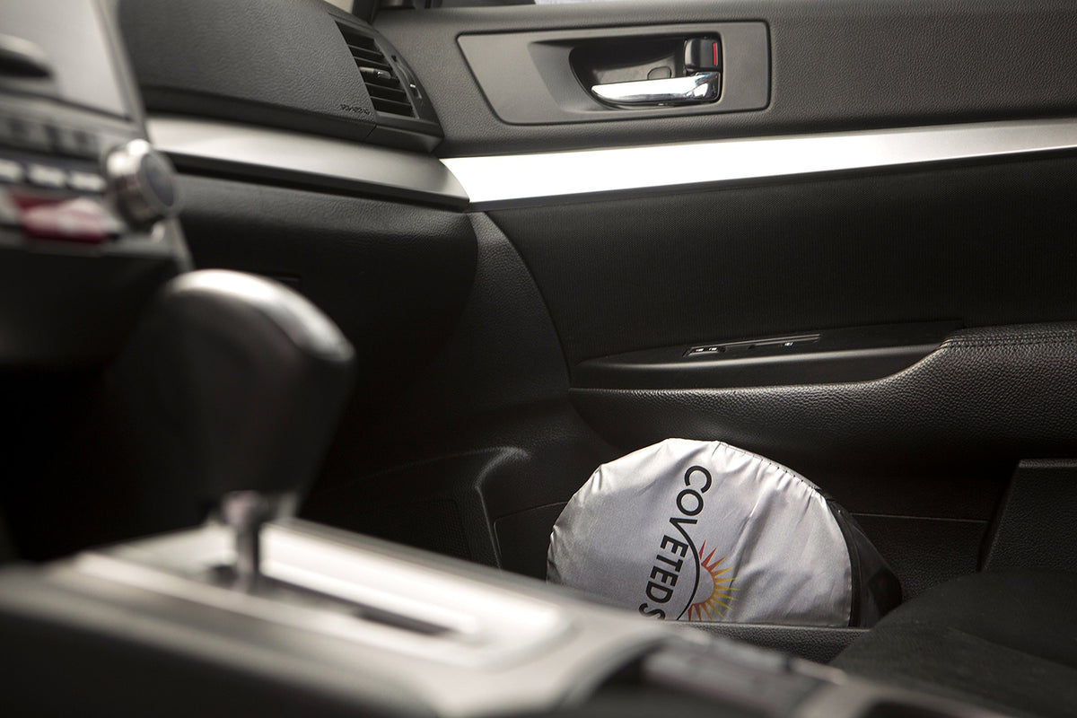 Coveted Shade deployed in minivan windshield lowering cabin heat