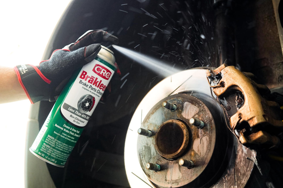 CRC Brakleen spraying on a brake caliper demonstrating fast-degreasing action for efficient service