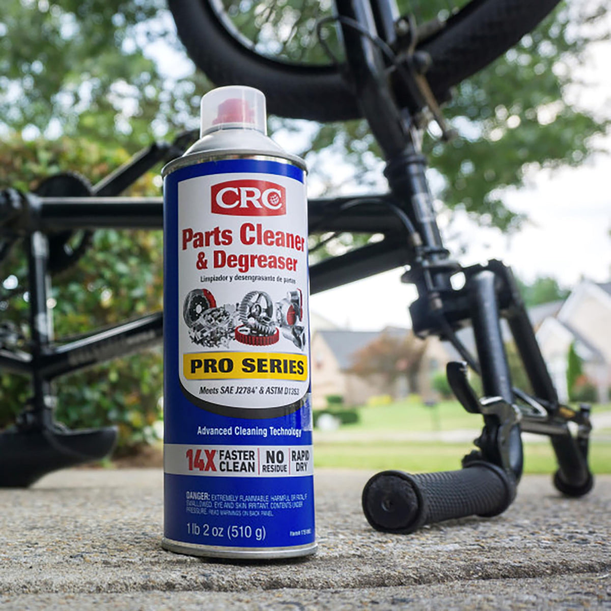 CRC aerosol spraying on engine part demonstrating powerful degreasing action