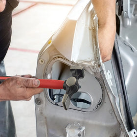 C&T pick and finish hammer striking panel to smooth dents and blend surfaces