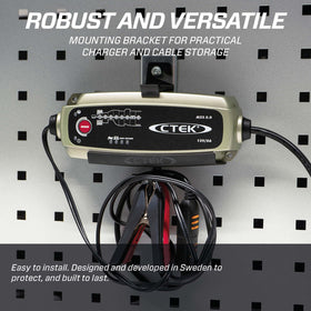 CTEK bracket next to charger showing scale and clear mounting benefits