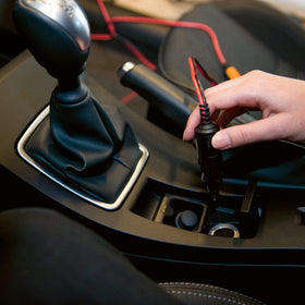 CTEK CIG Plug connected to CTEK charger demonstrating easy in-car battery charging