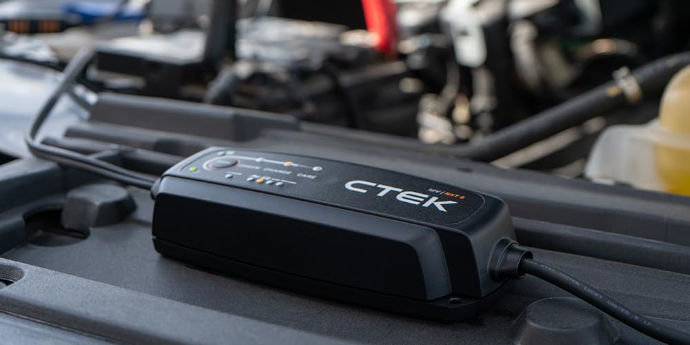 CTEK NXT 5 held in hand for size comparison showing compact portable benefit