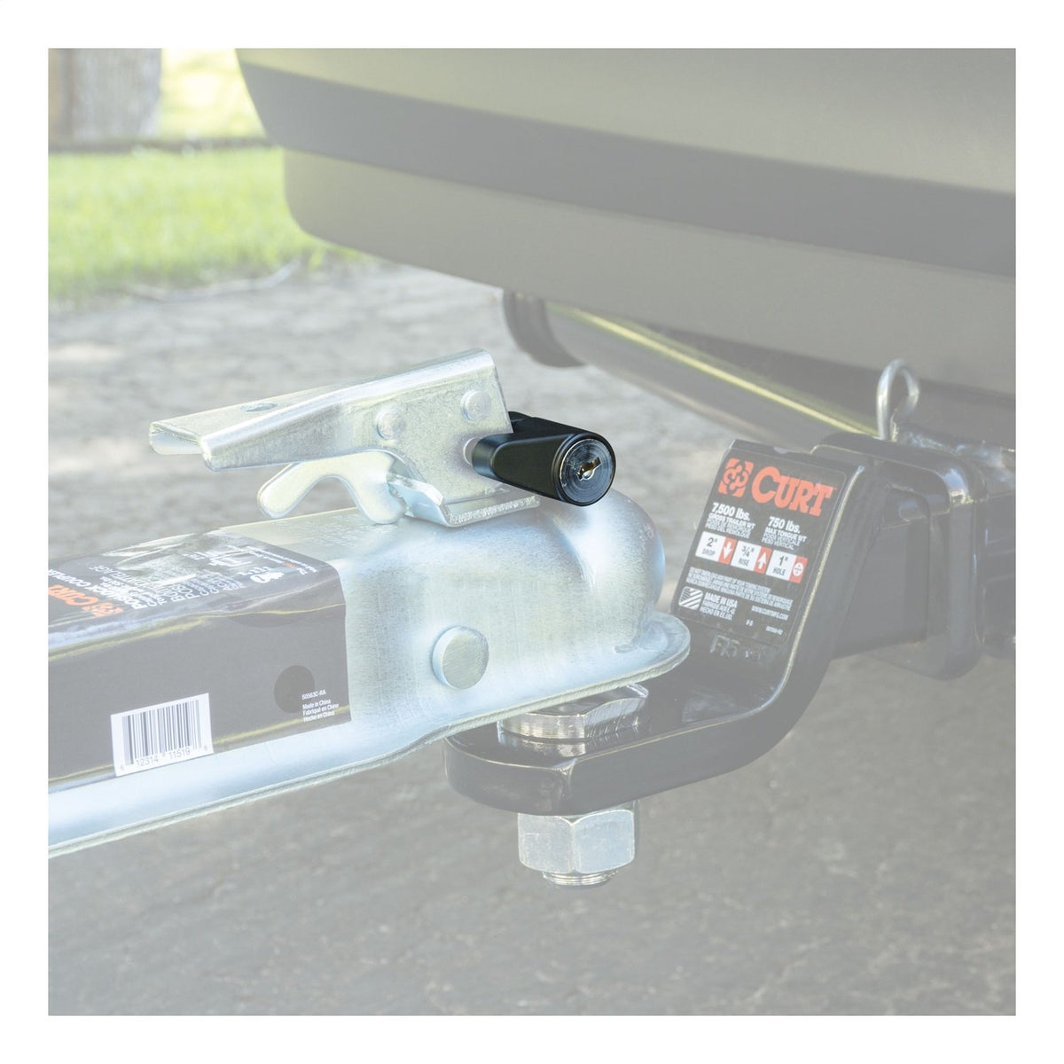 CURT 23521 on a parked trailer in a campsite illustrating practical security benefit