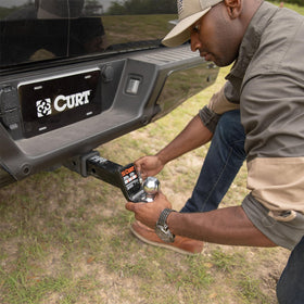 CURT ball mount mounted on receiver showing secure fit and stability benefit