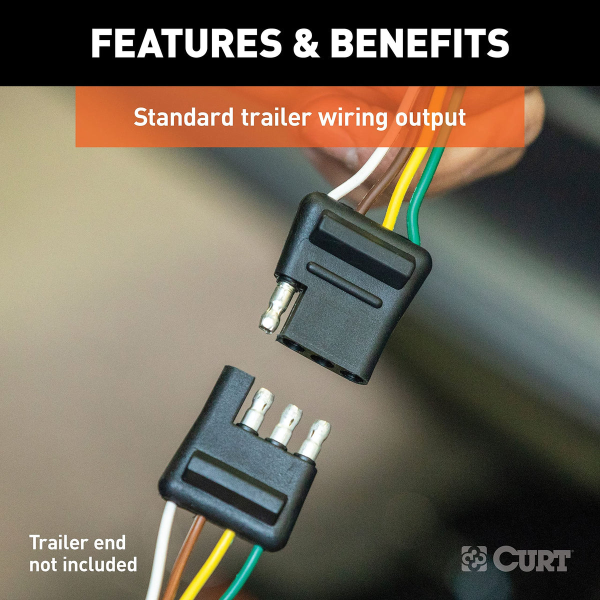 CURT converter held in hand showing compact 9x3x6 inch size for easy mounting