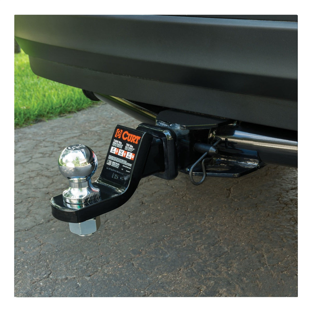 CURT hitch pin in towing lifestyle scene highlighting durable performance