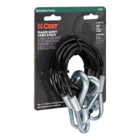 CURT safety cables installed on a small boat trailer in driveway showing practical towing readiness