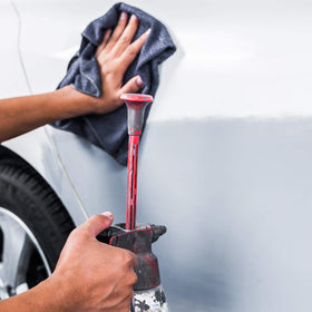 Custom Shop cleaner being applied to car panel with microfiber for better adhesion