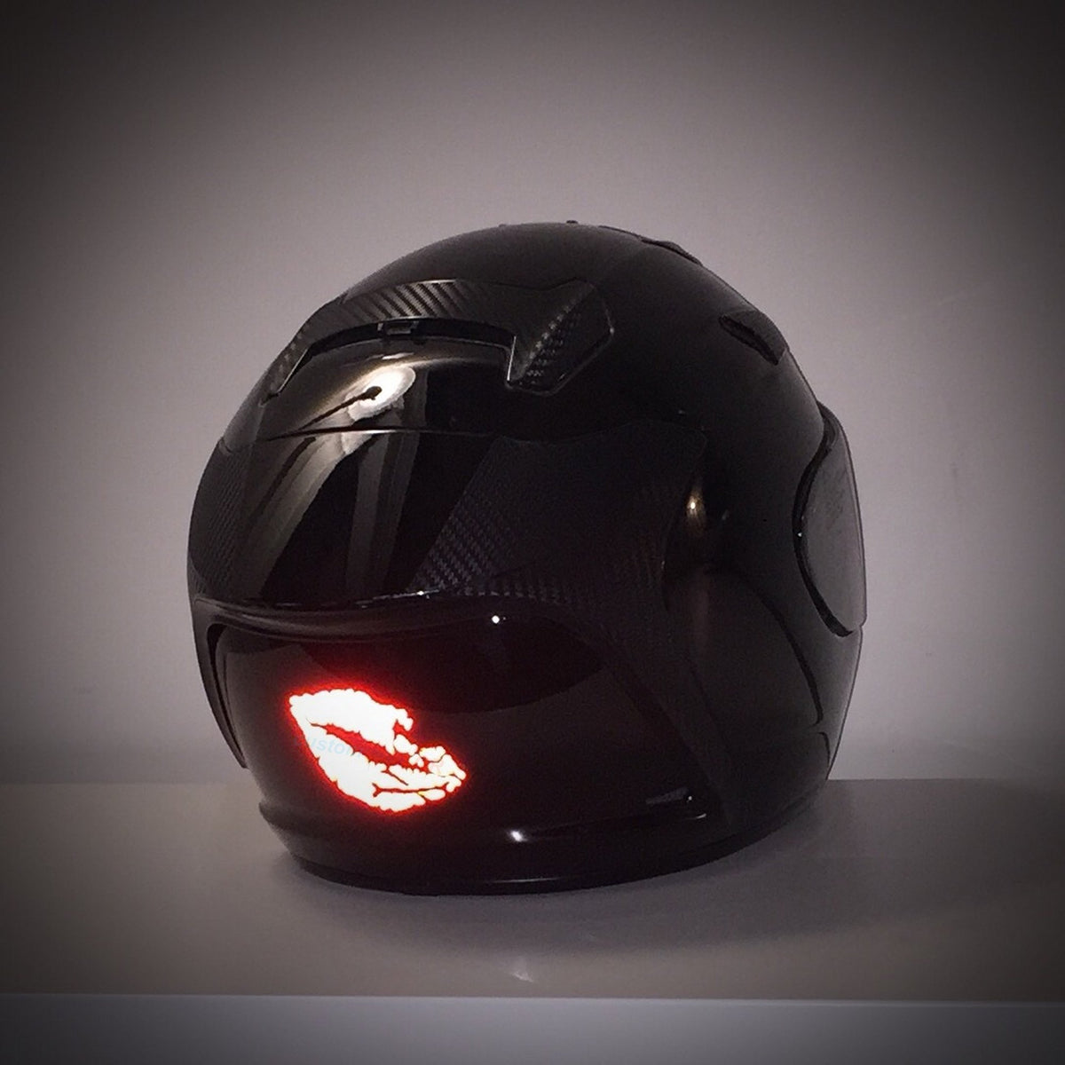 customTAYLOR33 decal on motorcycle helmet showing improved low-light visibility