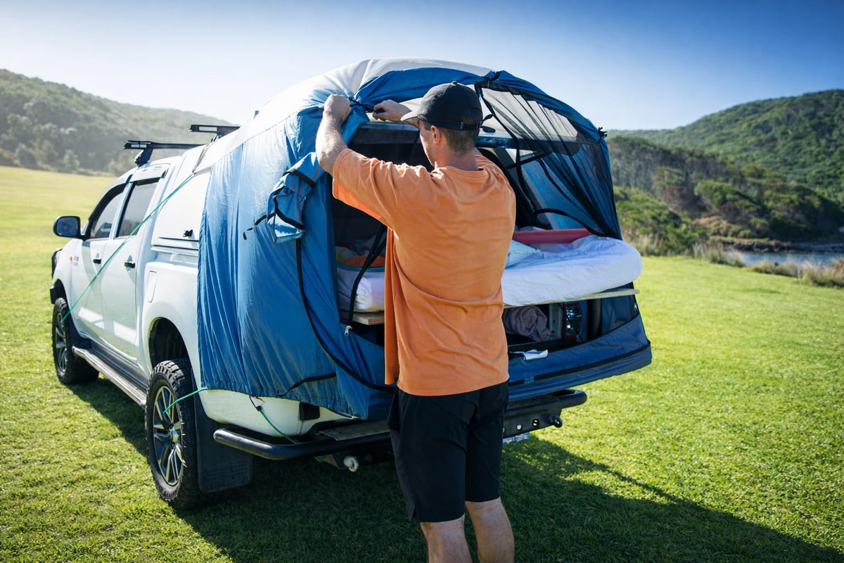 DAC DA2 lifestyle image at campsite showing quick conversion of truck to shelter