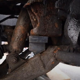 Dasbecan bumper stop installed on control arm showing proper fitment benefit