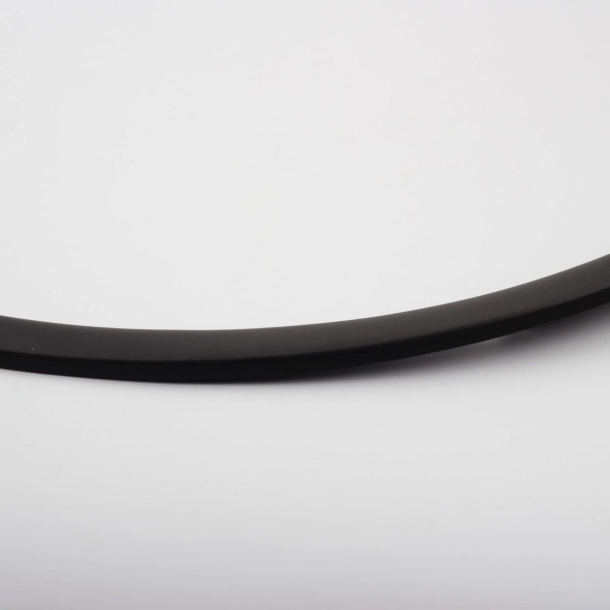 Dasbecan fender trim on vehicle in road setting demonstrating stone protection benefit