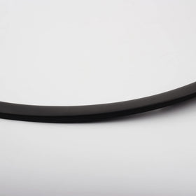 Dasbecan fender trim on vehicle in road setting demonstrating stone protection benefit
