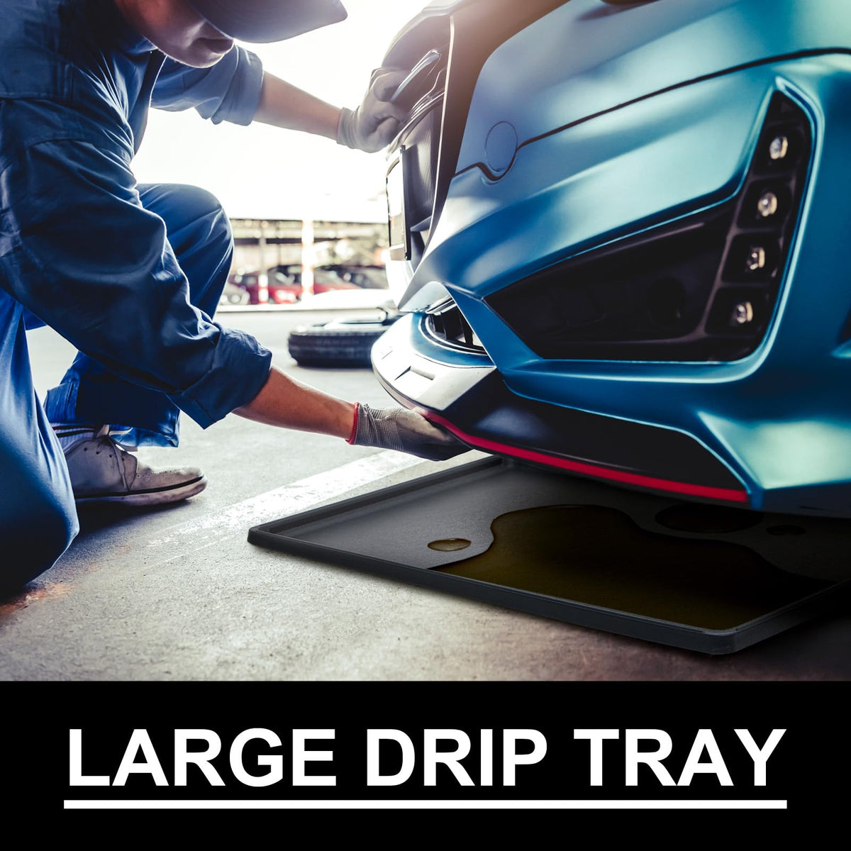 Datanly under car in use catching oil drips to protect garage floor