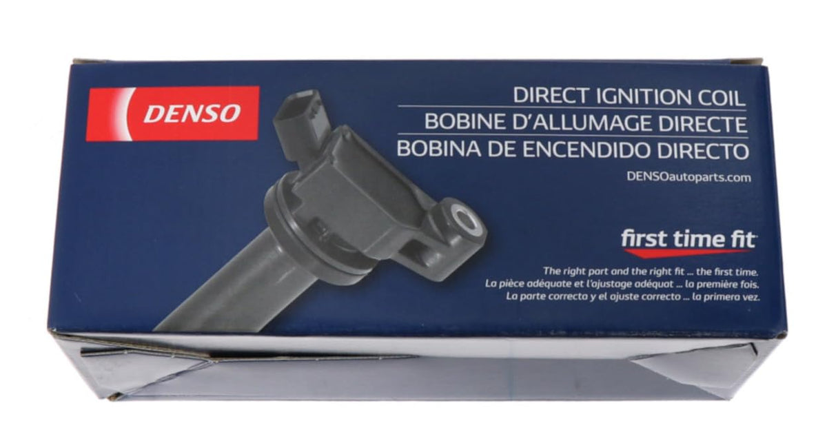 Denso 673-1310 installed on engine spark plug bore, brand ensures correct fit and performance