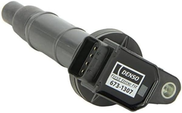 Denso coil seated in spark plug well demonstrating correct fit and efficient spark
