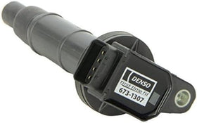 Denso coil seated in spark plug well demonstrating correct fit and efficient spark