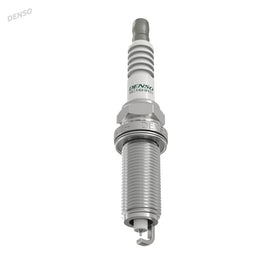 Denso spark plugs on workbench in garage conveying professional-grade reliability