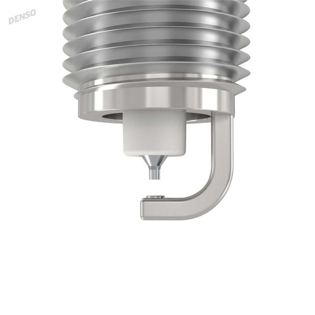 Denso spark plug beside ruler showing compact 0.7 mm electrode for focused spark