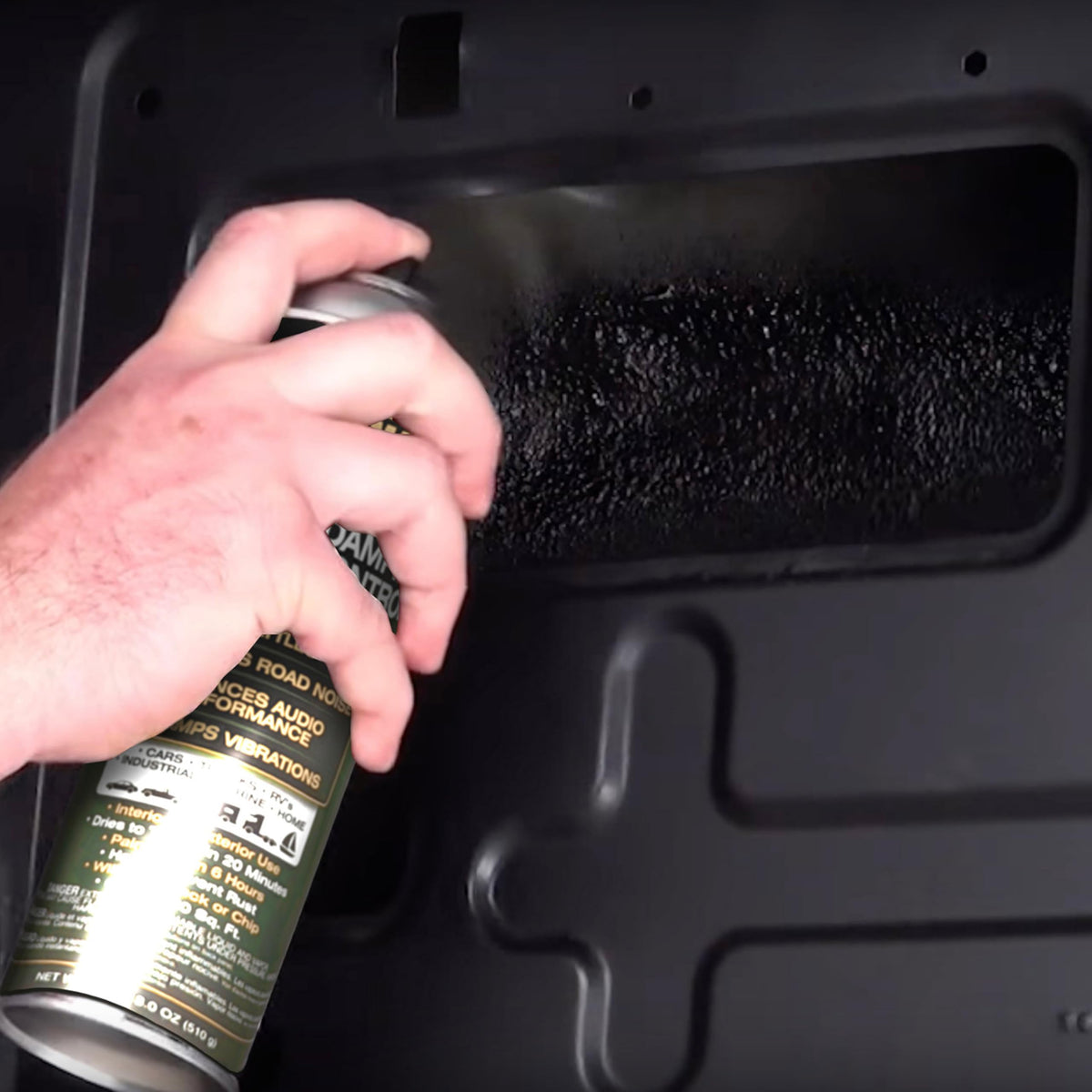 Design Engineering spray in use from hand applying even coating, demonstrates ease
