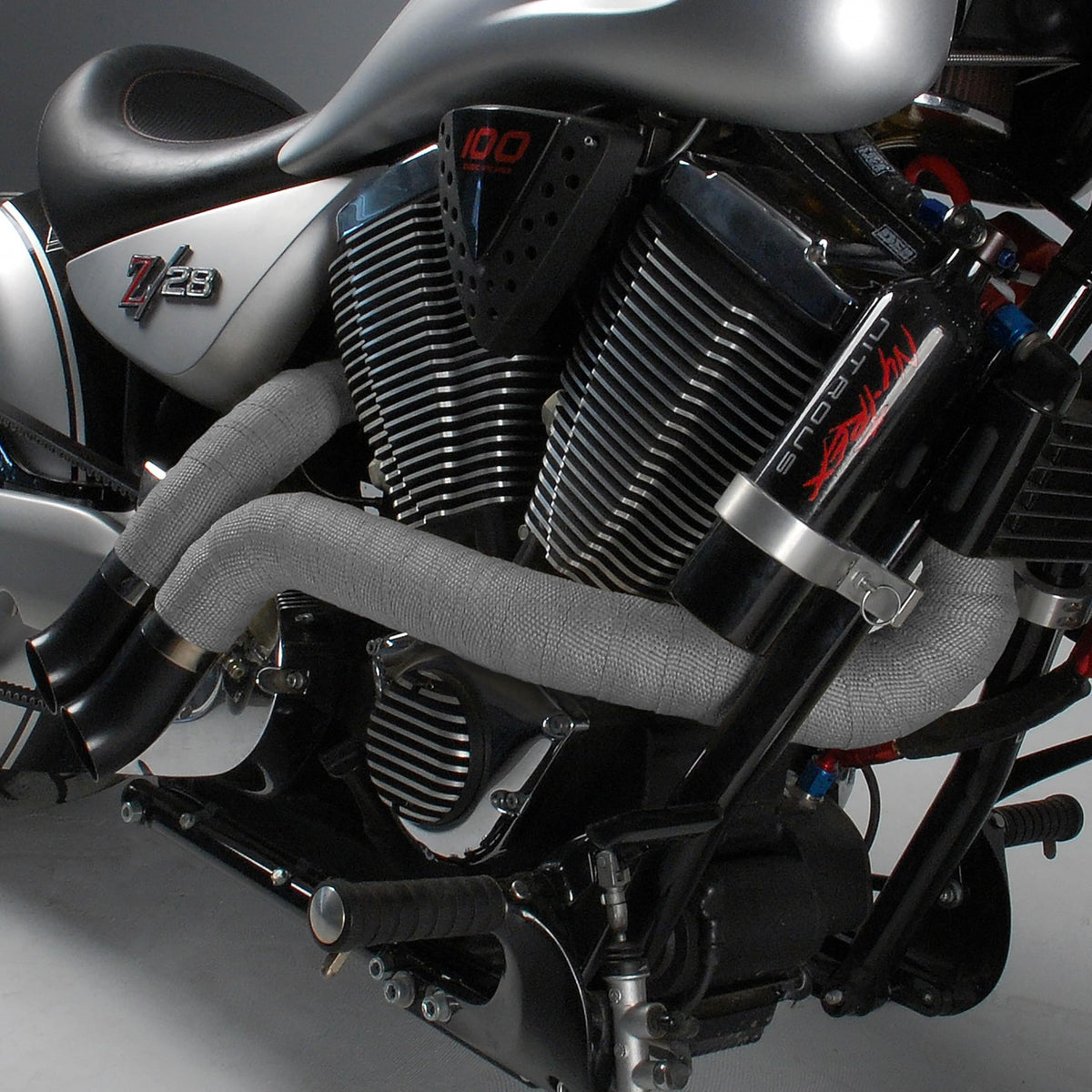Design Engineering coated exhaust header in use showing heat protection and reduced grime
