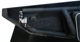 Dicater handle beside ruler showing compact size and improved grip benefit