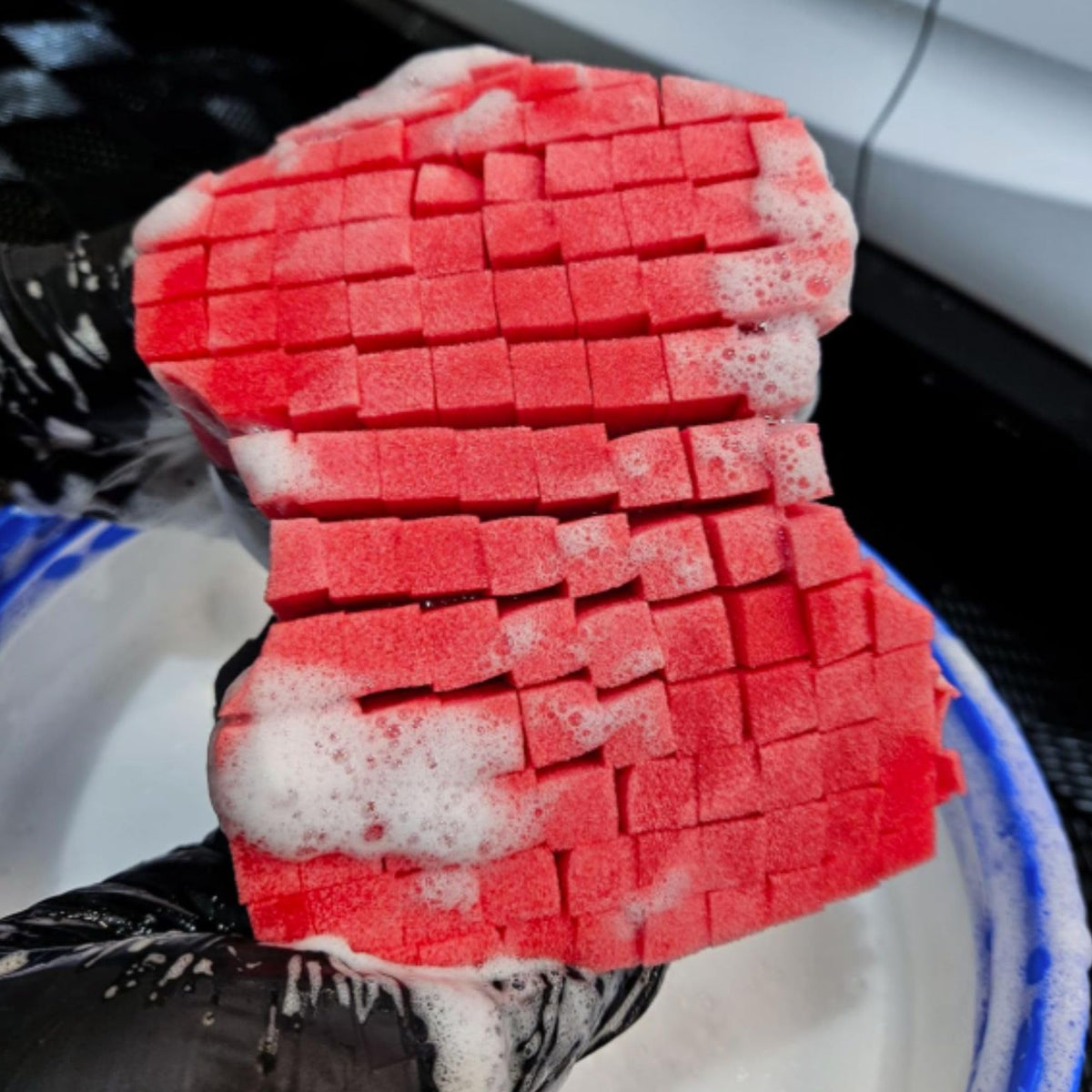 diy detail sponge next to hand for scale showing comfortable handling size