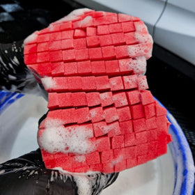diy detail sponge next to hand for scale showing comfortable handling size