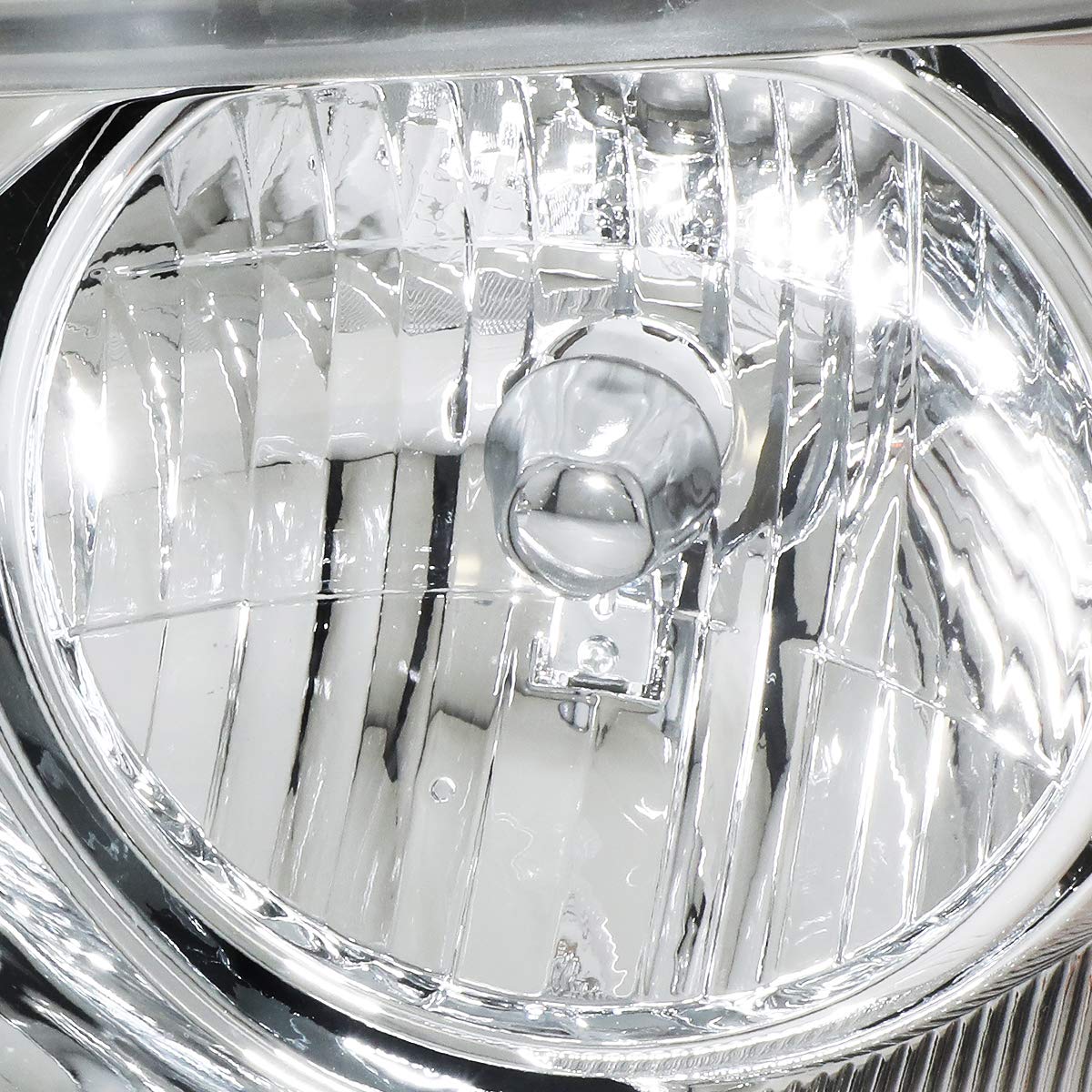 DNA MOTORING close-up of clear lens and chrome reflector highlighting durable finish and crisp beam benefit