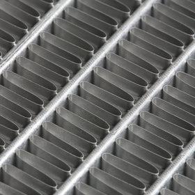 DNA Motoring radiator next to ruler to show core dimensions for accurate fitment