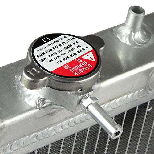 DNA MOTORING inlet and outlet ports showing OEM-sized 1¼-inch hose compatibility